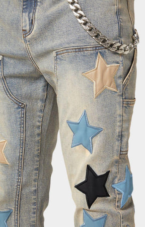 Silver-tone chain accessory on GUAPI Vintage Stars Denim.
