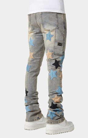Light-wash denim close-up with vintage fade and leather patches.
