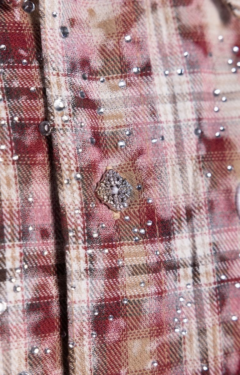 Premium cotton plaid shirt with elevated streetwear aesthetics.