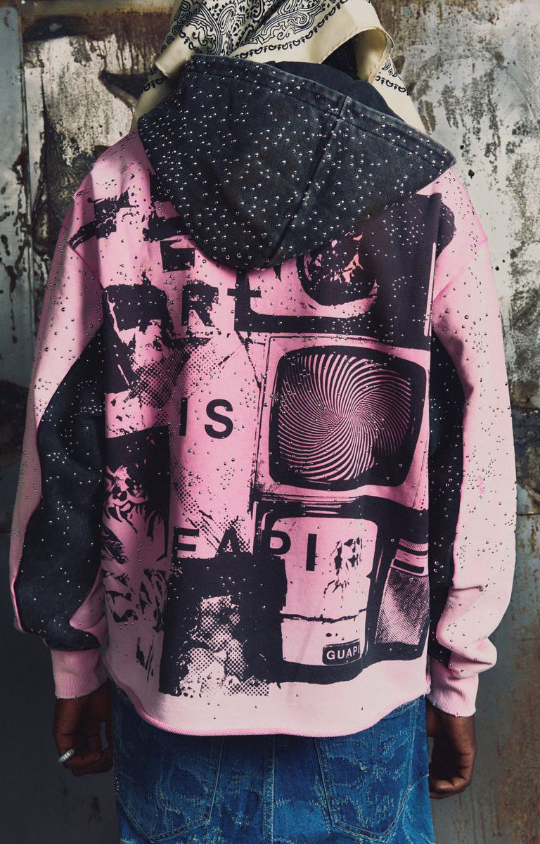 GUAPI Punk Rivets Hoodie in pink and black with all-over rivet embellishments, contrasting black hood and panels, bold punk-inspired graphic artwork, ribbed cuffs and hem. A statement piece for alternative and graphic streetwear styling.