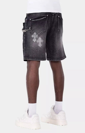 Black denim shorts featuring rhinestone cross embellishments and faded wash.