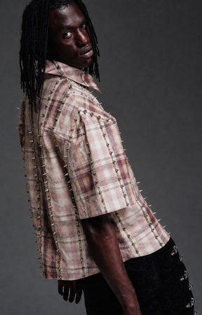 Guapi Vintage Rose Studded Plaid Shirt featuring a rose plaid pattern, metal toggle closures, studded trim detailing, pointed collar, short sleeves, and a relaxed streetwear fit.