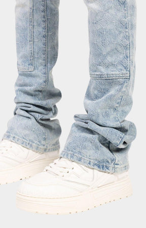 Flared leg opening detail on GUAPI Aqua Blue denim.