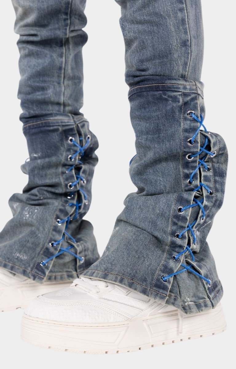 Slim fit cargo denim jeans with extended stacked hem construction.