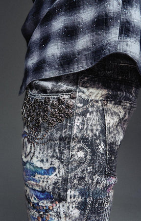 Guapi Hakai Spider Denim featuring textured embellished graphic details.