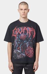 Guapi Spider rhinestone graphic t-shirt featuring oversized front artwork.