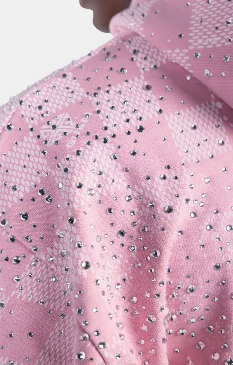 Close-up of GUAPI logo on French Rose Stardust hoodie.