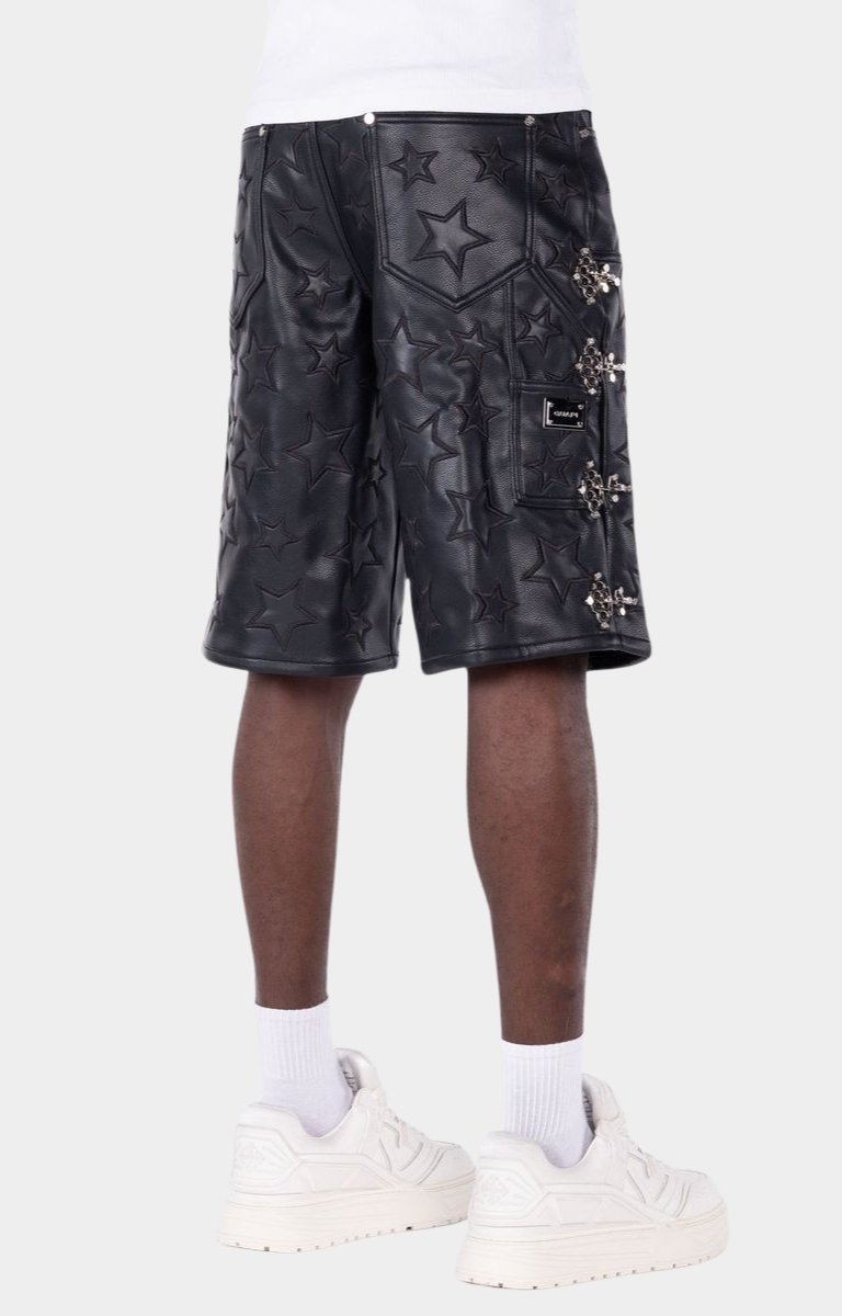 Guapi Black leather shorts with star patterns and studs on sides. 