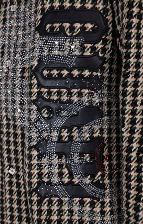 Detailed view of bold appliqué graphics on GUAPI shirt jacket.