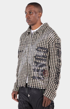 Signature chest branding on GUAPI rhinestone statement shirt.