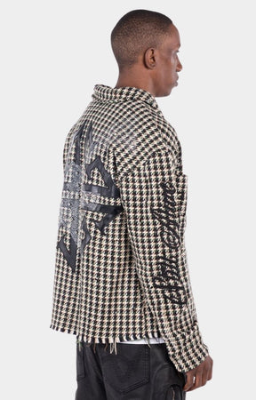 Raw-edge hem finish detail on GUAPI Still A Threat shirt jacket.