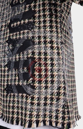 Close-up of hand-applied rhinestone embellishments on GUAPI Still A Threat shirt.