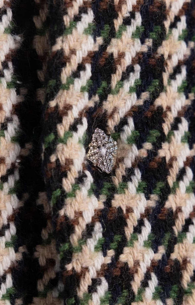 Premium textured woven fabric detail of GUAPI patterned overshirt.