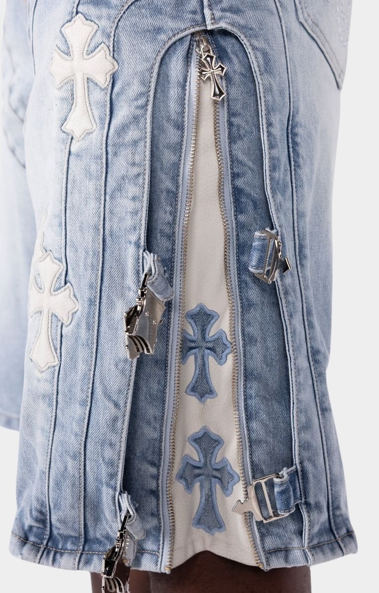 Utility-inspired denim shorts featuring side buckle strap accents