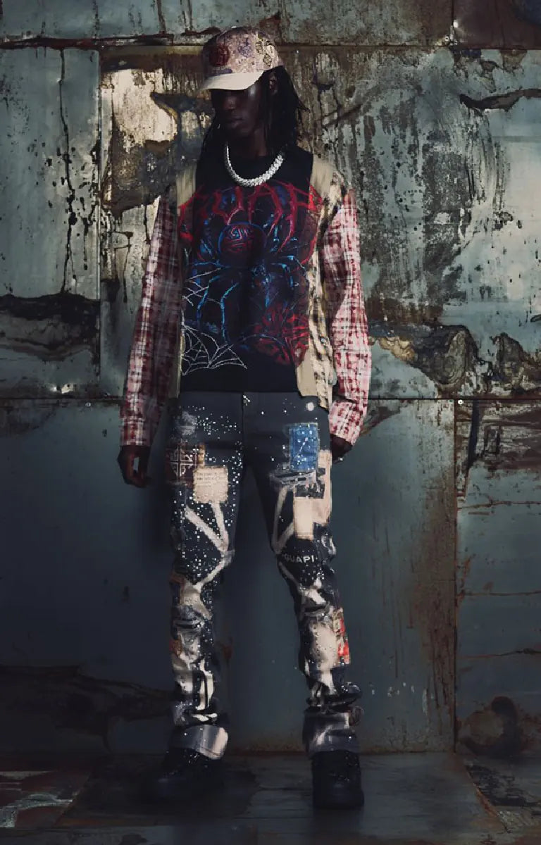 Guapi Vintage Black Chronicle Denim featuring a black base, multicolor collage-inspired prints, splatter effects, slim tailored fit, five-pocket construction and button-zip closure.