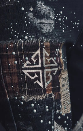 Splatter-style graphic detailing on Guapi Vintage Black Chronicle Denim