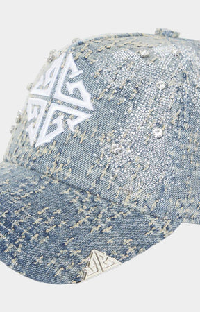 Distressed vintage blue denim texture detail on GUAPI cap