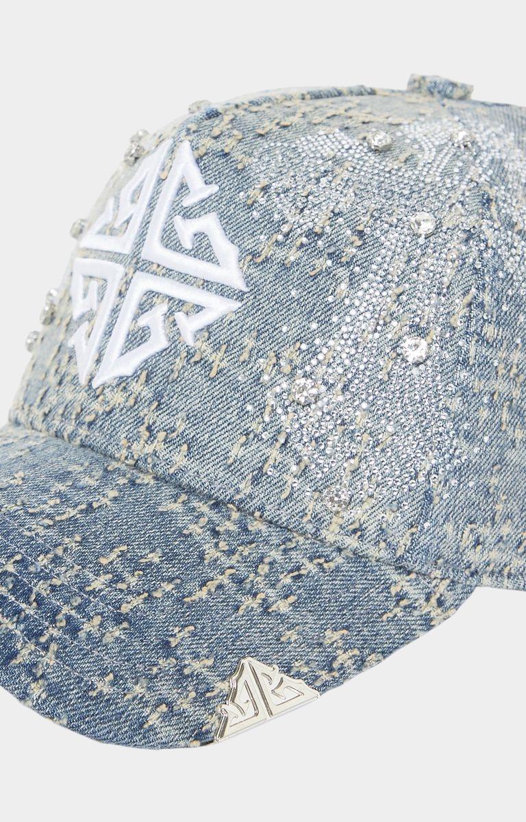 Distressed vintage blue denim texture detail on GUAPI cap
