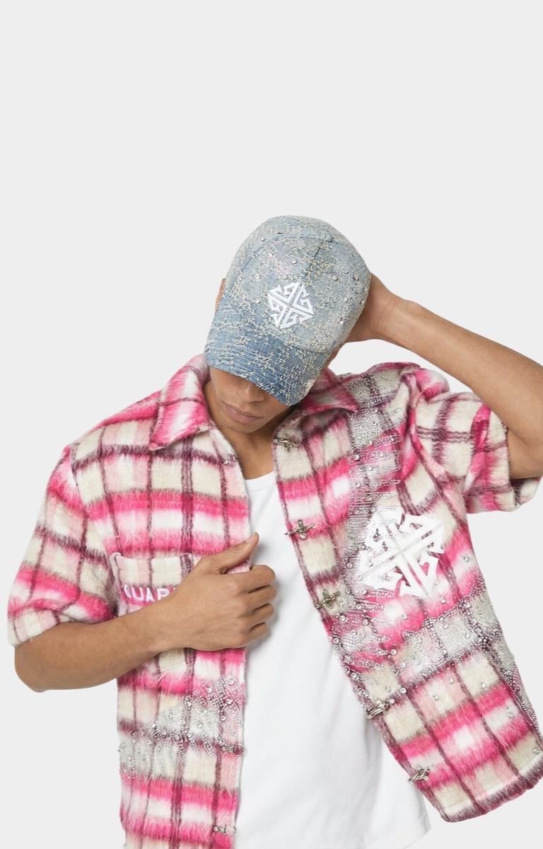 Top view showing distressed denim pattern on GUAPI cap