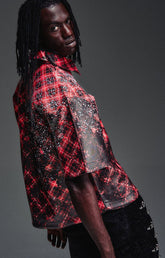 Guapi Vintage Inferno Leather Shirt featuring premium leather, red plaid with vintage burn-effect panels, scattered rivets, aviation clasp closures and a relaxed boxy fit.