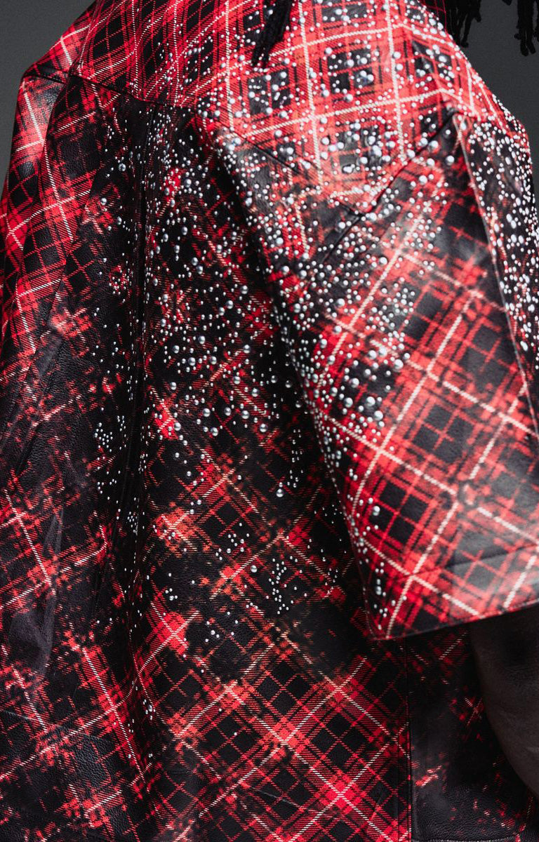 Close-up of plaid, burn-effect and hardware details on Guapi Inferno Leather Shirt.