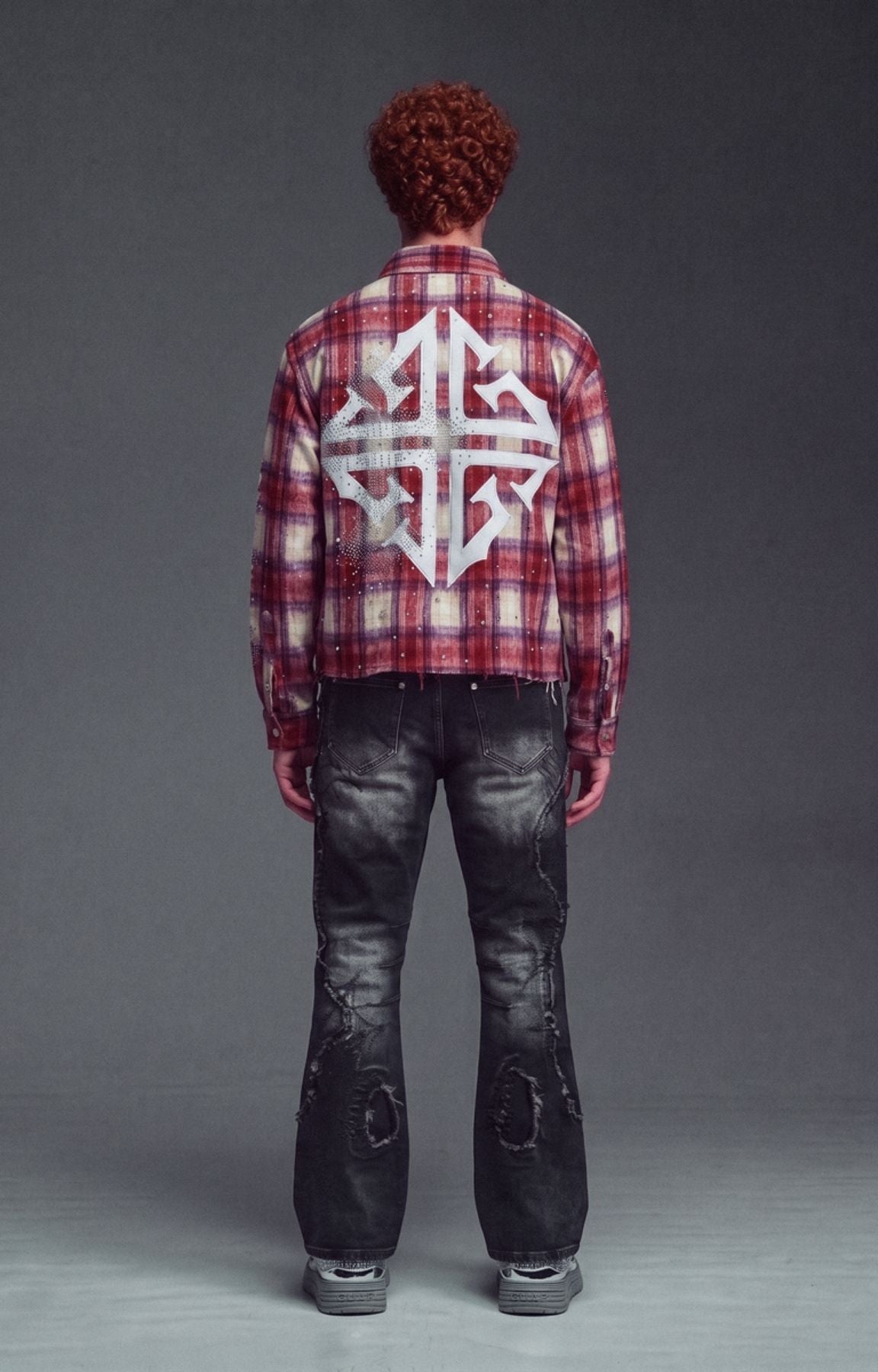 Guapi Vintage Red Plaid Shirt featuring a distressed red, cream and purple plaid pattern, rhinestone embellishments, graphic lettering, chest pocket and relaxed oversized fit.