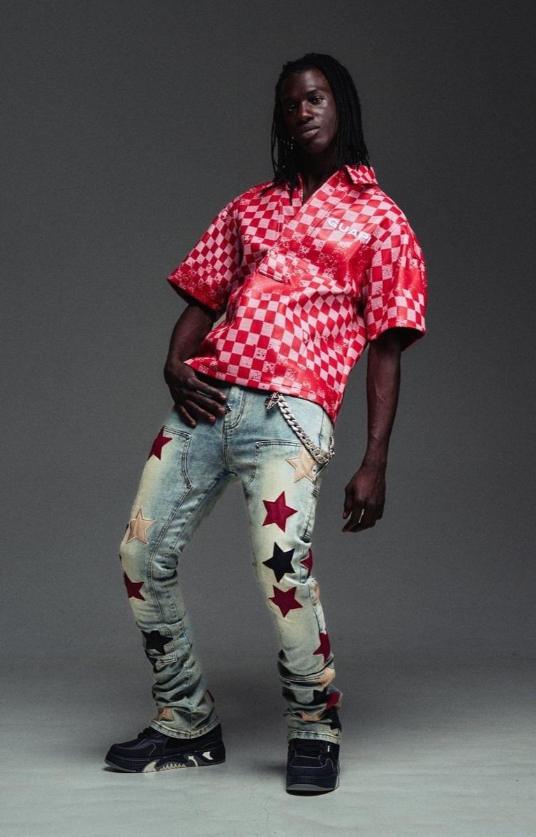 Vintage washed stretch denim fabric detail on Guapi jeans.