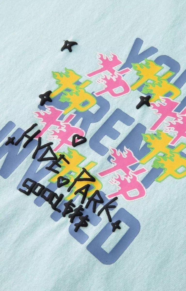 Blue Hyde Park oversized streetwear t shirt featuring layered graphic artwork.