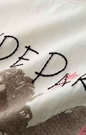 Hyde Park Get Off My Cloud Oversized and distressed graphic tee with embroidery detail on cream tee