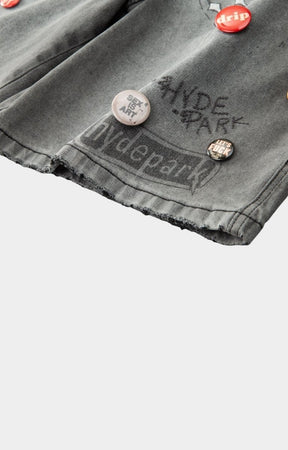 Gray denim jacket with 'Hyde Park' branding and buttons. 