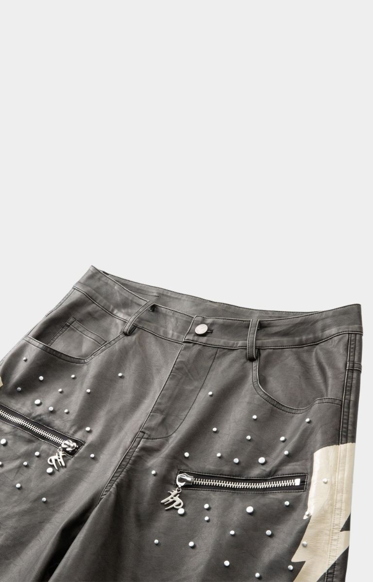 Faux leather texture detail on hyde park  black moto racer shorts with studs and 2 front pockets with hyde park emblem. 