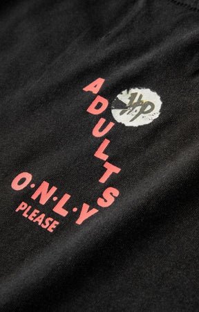 Close-up of Hard Luck graphic design on tee.