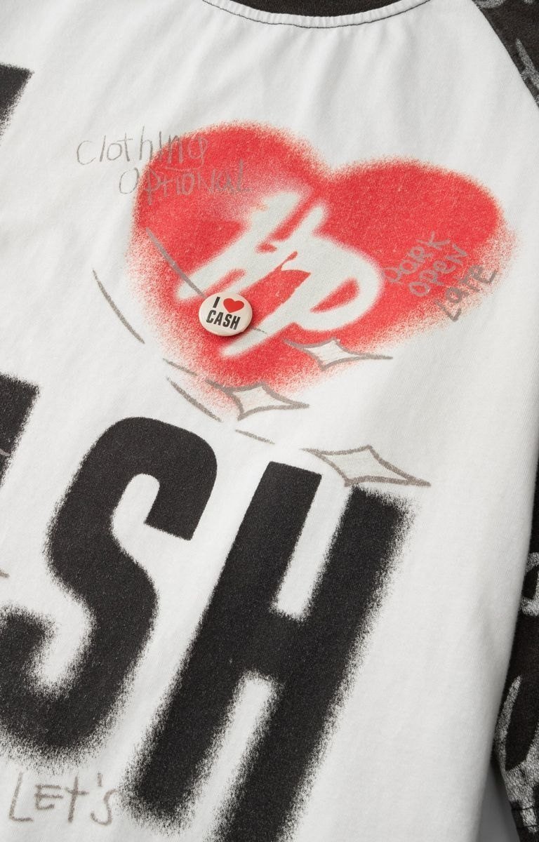 I Heart Cash graphic detail on black tee.