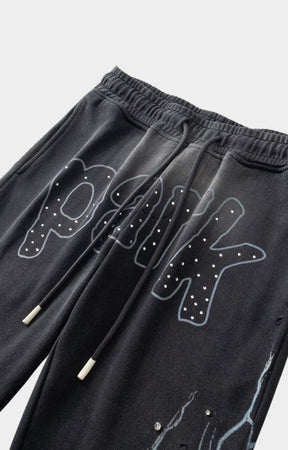 Pocket design close-up of Hyde Park Throw Back Jogger with logo print at front embellished with rhinestones.