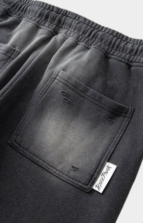 Pocket design close-up of Hyde Park Throw Back Jogger. distressed pockets with hyde park tag. 