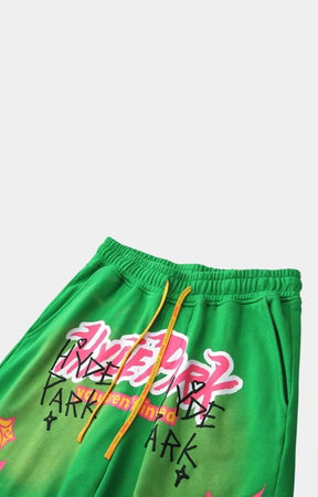 Angled view of Hyde Park green graphic streetwear shorts.