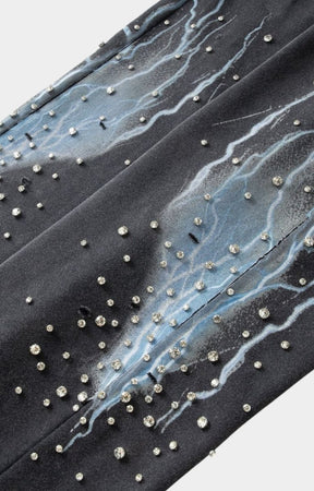 Lifestyle shot featuring Hyde Park Grayskull Wide Leg Jogger with embellisments and stud details. 