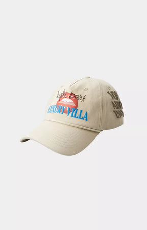 Angled view of Hyde Park Luxury Resort light khaki premium fashion cap.
