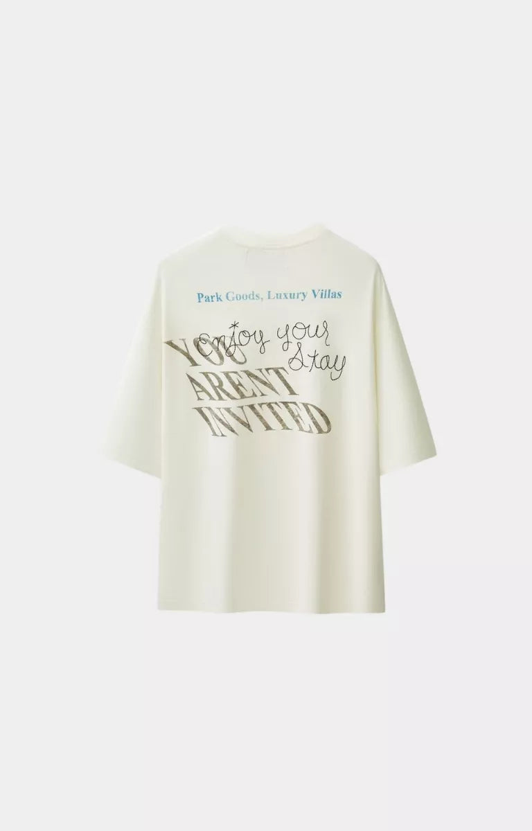 White oversized t-shirt back view hyde park luxury resort. 