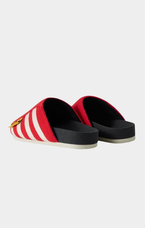 Molded footbed contour detail on hyde park red and white stripe slides. 