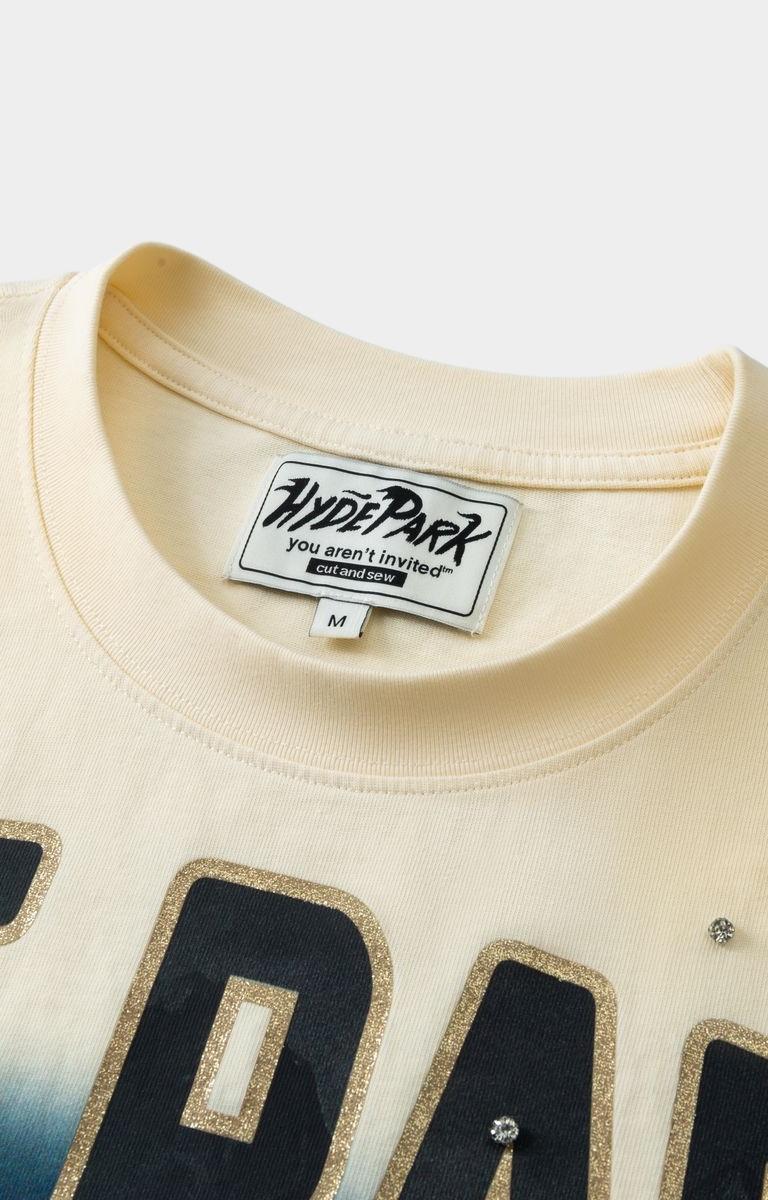 Close-up of a beige sweatshirt with 'Hyde Park' branding and text.