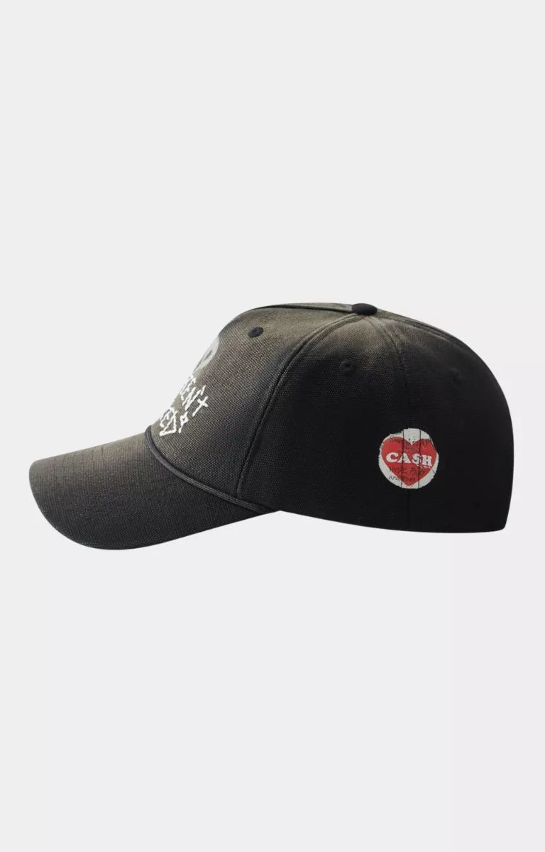 Side profile of Hyde Park Over Spray black streetwear cap with stretch cotton construction.