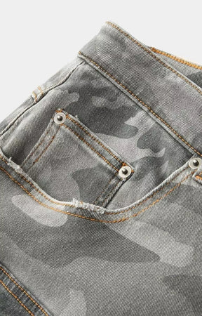 Black patchwork denim jorts by Hyde Park featuring camouflage panel details.