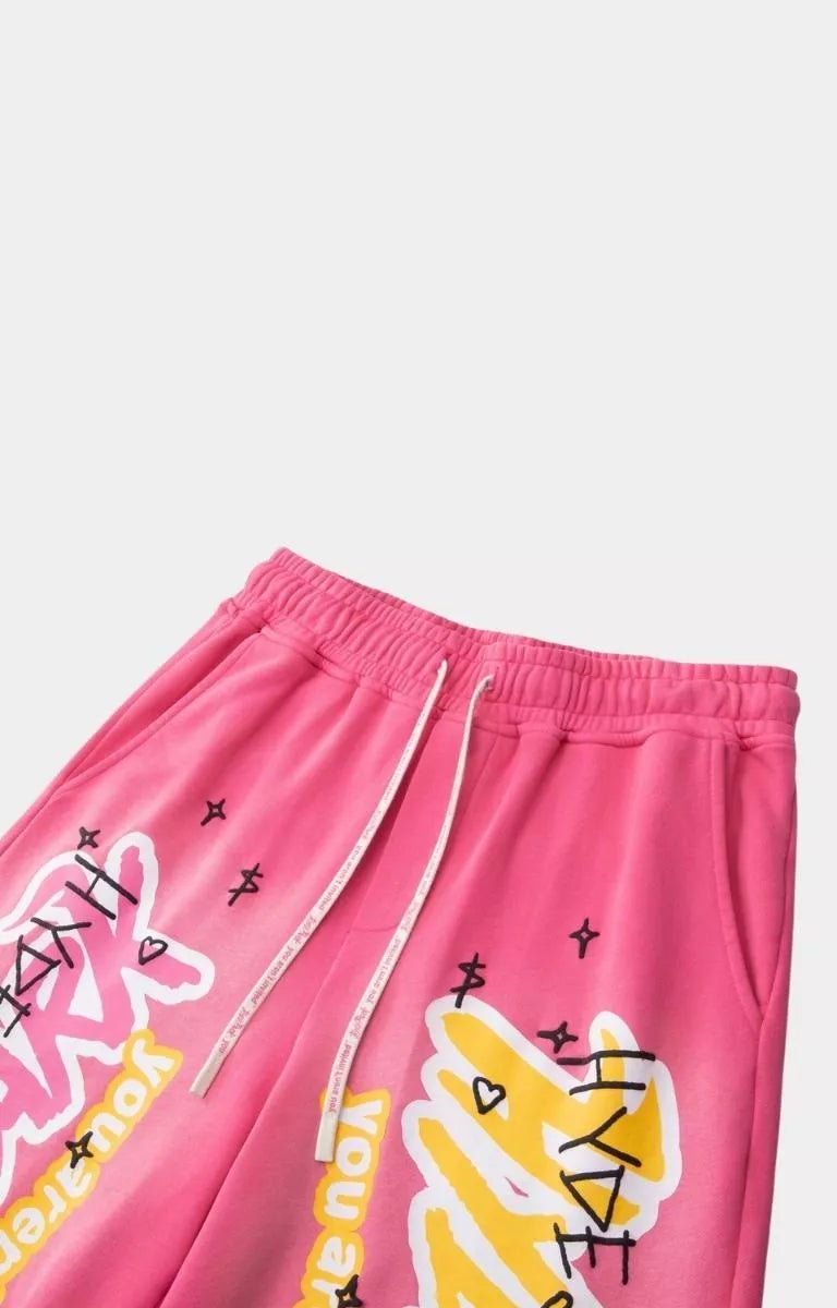 Angled view of Hyde Park pink graphic streetwear shorts.