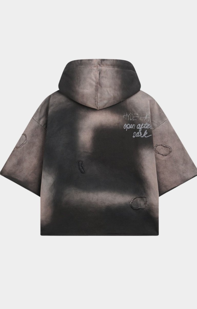 Back view of black oversized Hyde Park hoodie with tribal details.
