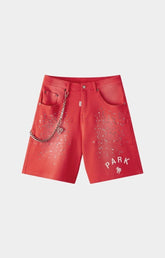 Hyde Park red studded denim shorts front view with rhinestones and metal chain. 