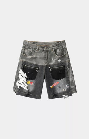 Hyde Park Upcycle camo patchwork denim jorts black front view with utility zip pockets.