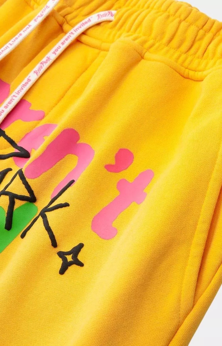 Yellow drawstring cotton shorts featuring Hyde Park graphic artwork.