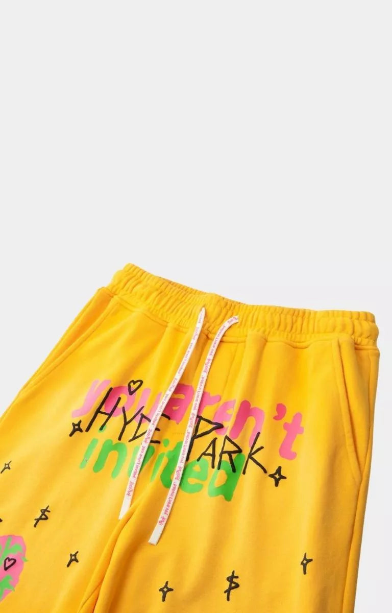 Angled view of Hyde Park yellow graphic streetwear shorts.