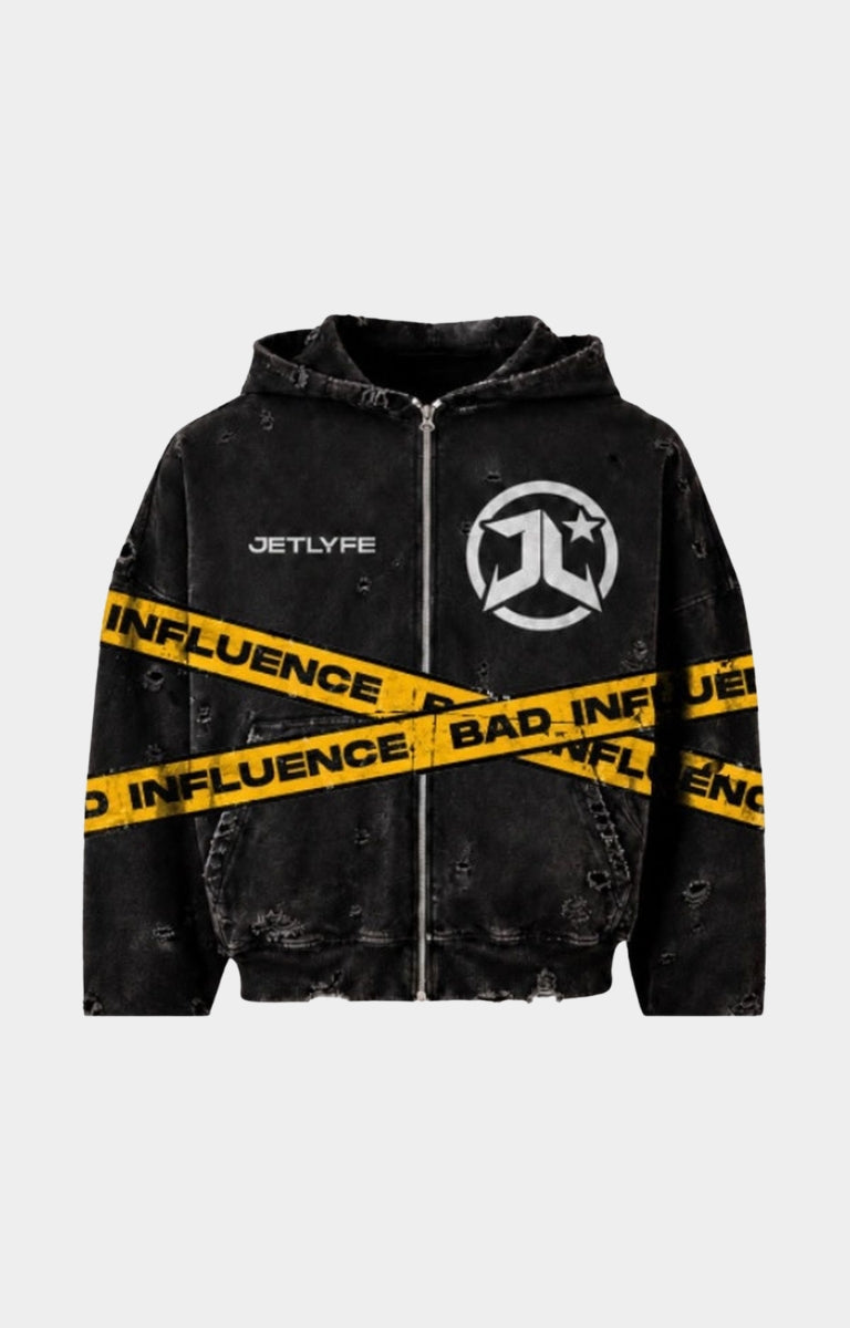 Shop the JETLYFE Bad Influence Hoodie in black, featuring a faded finish, distressed detailing, bold yellow “Bad Influence” graphics across the front and sleeves, chest branding, a full-zip front, attached hood, and front pockets. A statement streetwear piece for pairing with denim, cargo pants, and casual everyday outfits.